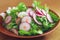 Healthy delicious food fresh greens dandelion radish salad on wooden table