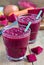 Healthy detox beetroot, carrot, apple and lemon juice smoothie, vertical