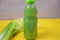 Healthy detox juice in plastic bottles on soft orange background. Colorful bottles. Healthy organic drink. Different