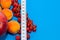 Healthy diet composition, tape measure, raspberries, apricots, apple and red currants