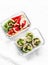 Healthy diet food lunch box - fruit and chicken, beans, green salad pita bread on a light background, top view. Sweet b savory