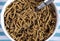 Healthy diet high dietary fiber breakfast with bowl of bran cereal closeup