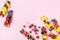 Healthy and diet snack or dessert from sandwiches with creamy cheese and summer berry fruits on pink trendy background top view.