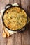 Healthy dietary English food Bubble & Squeak from baked mashed potatoes with cabbage and Brussels sprouts in a pan on the table.