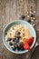 Healthy or dietetic breakfast - yoghurt, oat flakes, blueberries, banana and strawberries