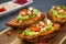 Healthy dinner - Baked sweet potatoes served with guacamole, feta cheese and pomegranate