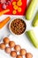 Healthy dogfood with eggs, vegetables and meat on kitchen background top view