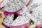 Healthy dragon fruit or pitaya pieces background, close up of beautiful fresh sliced dragon fruit with texture in the market in