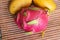 Healthy dragon fruits on sackcloth and mango