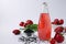 Healthy drink strawberries with basil seeds in a bottle on white background, Closeup, Copy space