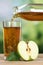 Healthy drinking apple juice pouring from apples into a glass