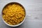 Healthy Dry Farfalline Pasta in a Bowl, top view. Flat lay, overhead, from above. Space for text
