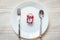 Healthy Eat Meal Time and Reminder Breakfast Concept, Food Timing Cycles for Eating, Red Alarm Clock With Stainless Steel Spoon