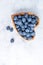 Healthy eating antioxidant blueberries in a wooden bowl heart shaped top view