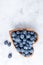 Healthy eating antioxidant blueberries in a wooden bowl heart shaped top view