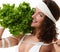 Healthy eating concept. Dieting. Woman hold lettuce broccoli and