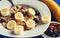 Healthy eating, food and diet concept - oatmeal with berries, nuts and bananas, white plate, blue wooden background.