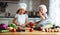 Healthy eating. Happy children prepares vegetable salad in kitc