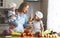 Healthy eating. Happy family mother and children prepares vegetable salad
