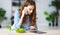 Healthy eating. happy young girl eating salad with tablet pc in morning in kitchen