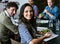 Healthy eating keeps her going thorugh the business day. Portrait of a young office worker eating lunch with coworkers