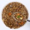 Healthy eating lentil soup stew with lentils on spoon from above