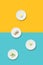 Healthy eating minimalist pattern. White plates with diet food on a yellow-blue background. Diet for weight loss