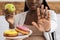 Healthy Eating During Pregnancy. Black Pregnant Lady Refusing Unhealthy Donuts, Choosing Apple