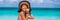 Healthy eating summer vacation happy woman banner. Asian bikini girl on weight loss apple fruit snack on beach holidays