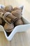 Healthy eating, various nuts in a white bowl, star shaped, wooden table, Christmas decoration