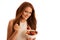 Healthy eating - woman eats a bowl of fruit salad isolated over