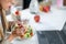 Healthy eating at work. Woman indulges in a delightful fresh salad at her workplace. With every bite, she embraces the nourishing