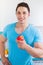 Healthy eating young man eat apple fruit in the kitchen portrait