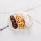 Healthy eclairs or profitroles on marble background