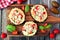 Healthy eggplant pizzas with melted mozzarella, tomatoes and basil