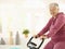 Healthy elderly woman on exercise bike