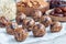Healthy energy balls with cranberries, nuts, dates and rolled oats on parchment, horizontal