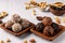 Healthy energy balls of nuts, oatmeals and dried fruit with coconut, flax and sesame seeds on wooden coconut plates on a white