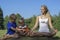 Healthy family doing yoga in the park