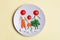 Healthy family eating concept, cute man, woman and child made of fresh vegetables on a plate