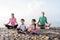 healthy family meditate together outdoor