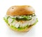 Healthy fish burger with rocket and mayonnaise