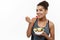 Healthy and Fitness concept - Beautiful American African lady in fitness clothes on diet eating fresh salad. Isolated on