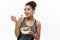 Healthy and Fitness concept - Beautiful American African lady in fitness clothes on diet eating fresh salad. Isolated on