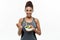 Healthy and Fitness concept - Beautiful American African lady in fitness clothes on diet eating fresh salad. Isolated on