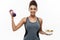 Healthy and Fitness concept - beautiful sporty African American on diet holding dumbbell and fresh salad on hands