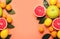 Healthy food background. Citrus fruit with leaves. Living coral background. Color trend 2019