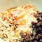 Healthy food - breakfast in a white dish. Muesli, yoghurt, oatmeal with chocolate, honey and cinnamon