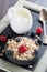 healthy food - cereal, fresh berries and jug of milk, close-up