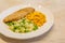 Healthy food chicken breast with steamed white rice, broccoli, corn and grated carrot isolated on white